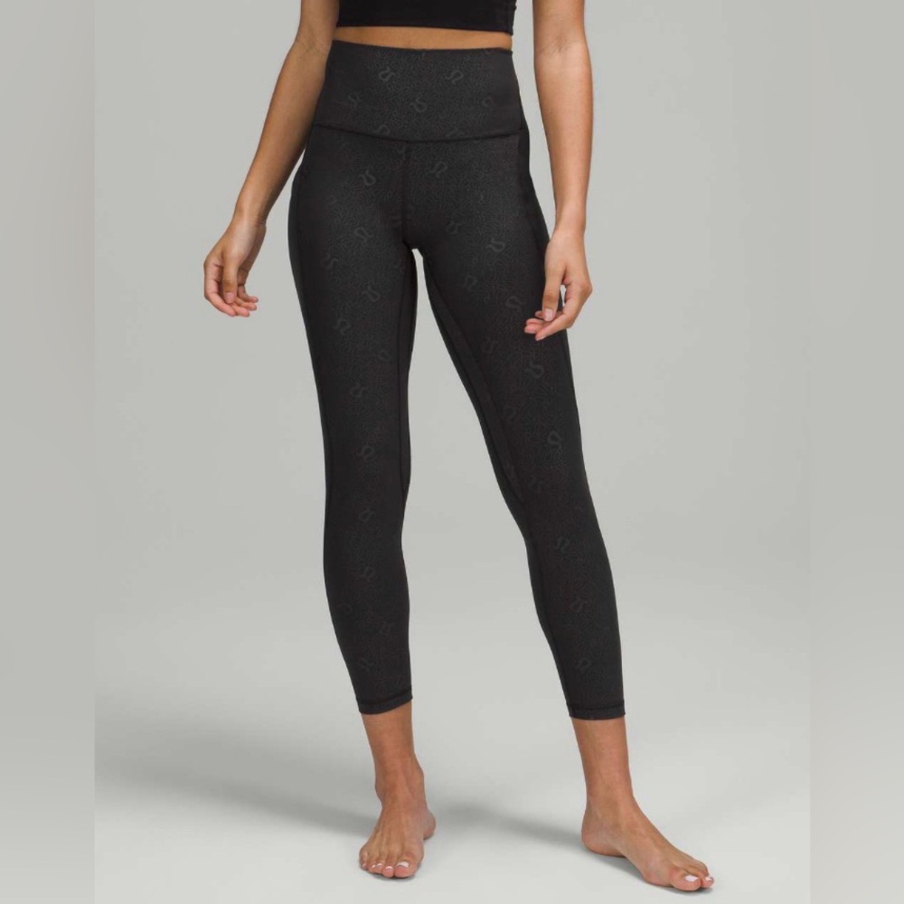 Lululemon align (nulu) size 2, 25”, with pockets, black yoga emboss logo pattern
